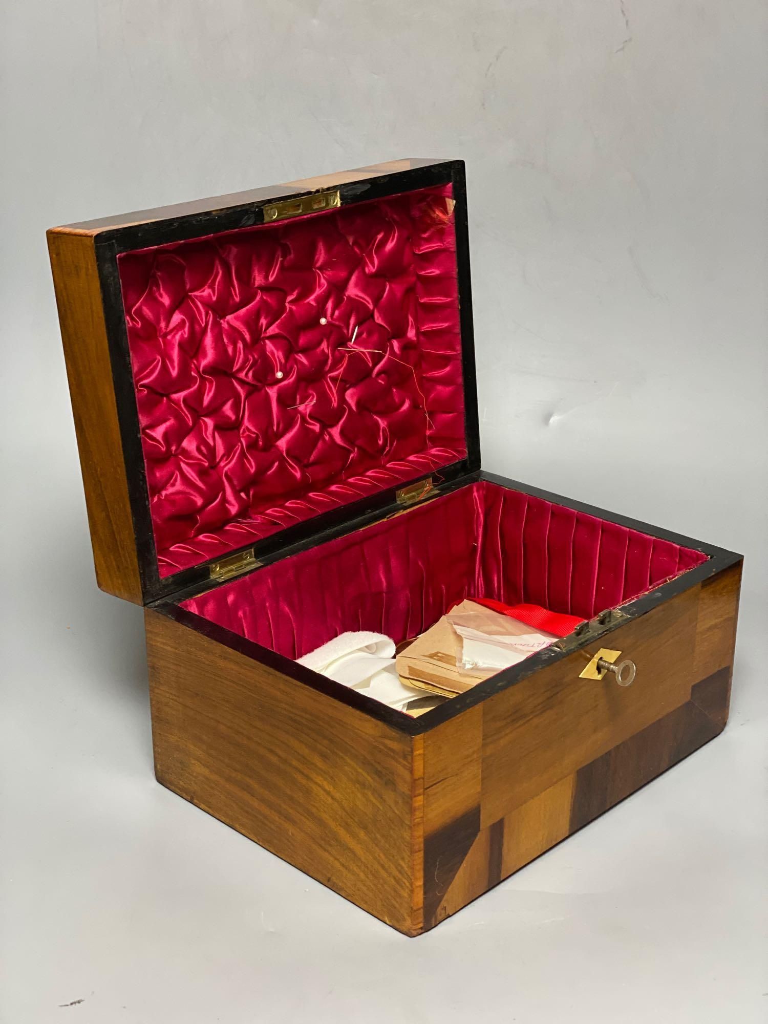 A Victorian crossbanded parquetry work box, 28cm and a rosewood writing slope